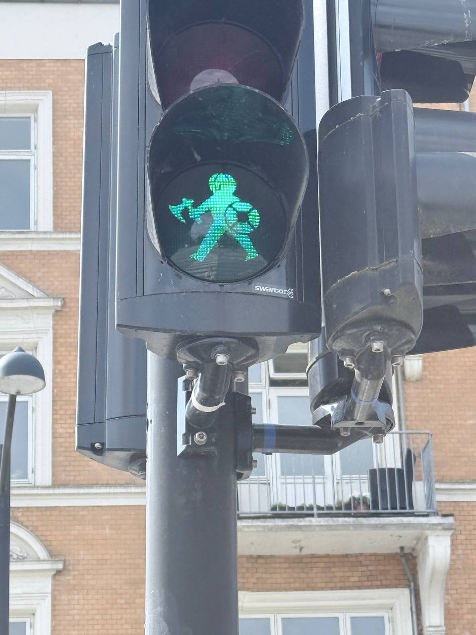 Green pedestrian walk signal on SWARD traffic light, Aarhus