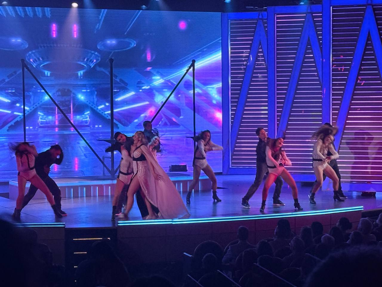 Main show - dancers on stage with emoji backdrop