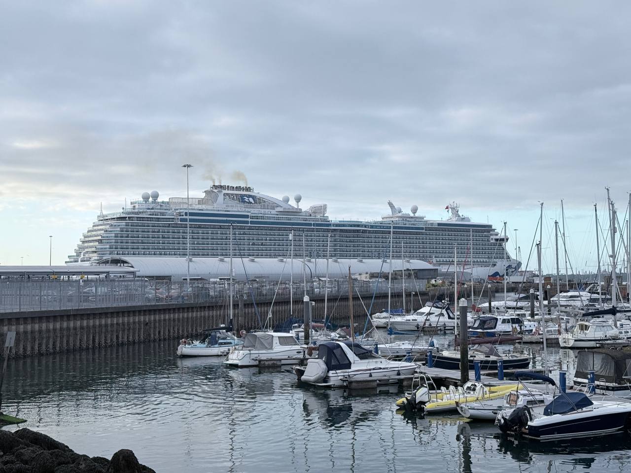 Majestic Princess cruise ship docked at Southampton terminal with marina in foreground