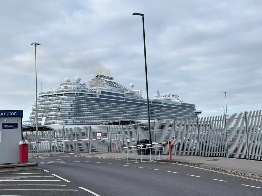 Majestic Princess cruise ship visible from the terminal road approaching security barriers