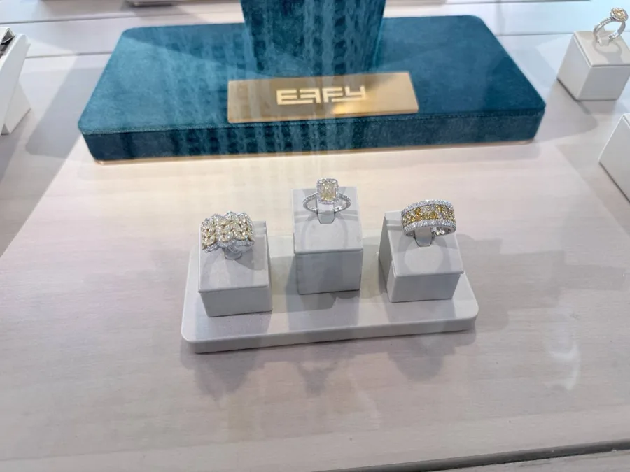 Three luxury diamond rings on display at the jewelry shop
