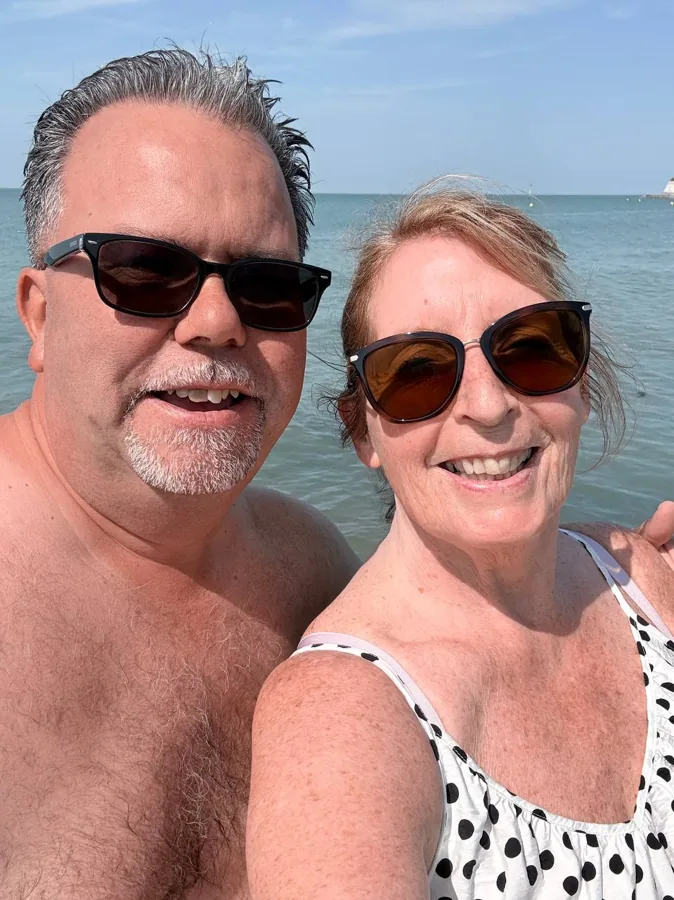 Angie and Iain smiling in the sea at Westgate-on-Sea